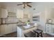 Inviting breakfast bar with a view of the countertop seating, lovely cabinets, and tasteful decor at 11085 E Becker E Ln, Scottsdale, AZ 85259
