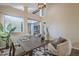 Bright dining area with tall ceilings, stylish lighting, and a view into other living spaces at 11085 E Becker E Ln, Scottsdale, AZ 85259