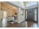 Inviting entryway featuring dark wood floors, high ceilings, and an abundance of natural light at 11085 E Becker E Ln, Scottsdale, AZ 85259