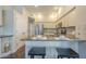 Spacious kitchen featuring a breakfast bar, stainless steel appliances, and ample counter space at 11085 E Becker E Ln, Scottsdale, AZ 85259