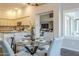 The kitchen provides granite countertops and stainless steel appliances and view of the dining room at 11085 E Becker E Ln, Scottsdale, AZ 85259