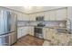 Modern kitchen featuring stainless steel appliances and granite countertops at 11085 E Becker E Ln, Scottsdale, AZ 85259