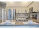 Kitchen featuring a breakfast bar, stainless steel appliances, and granite countertops at 11085 E Becker E Ln, Scottsdale, AZ 85259