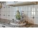 Close up of the kitchen counter styled with a decorative tray and glass accessories at 11085 E Becker E Ln, Scottsdale, AZ 85259