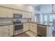 Bright kitchen featuring stainless steel appliances and granite countertops at 11085 E Becker E Ln, Scottsdale, AZ 85259
