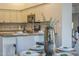 The kitchen provides granite countertops and stainless steel appliances and view of the dining room at 11085 E Becker E Ln, Scottsdale, AZ 85259