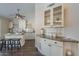 Open concept kitchen showcases granite countertops, white cabinetry, and island seating at 11085 E Becker E Ln, Scottsdale, AZ 85259