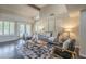 Spacious living room boasting an open floor plan, designer rug and lots of natural light at 11085 E Becker E Ln, Scottsdale, AZ 85259