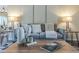 Comfortable living room featuring a plush grey sofa and stylish decor at 11085 E Becker E Ln, Scottsdale, AZ 85259