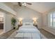 This main bedroom features vaulted ceilings with fan and a comfortable bed with neutral decor and carpeted floors at 11085 E Becker E Ln, Scottsdale, AZ 85259