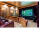 Home theater with comfortable seating, large screen, and custom design for entertainment at 13141 E Cibola Rd, Scottsdale, AZ 85259