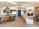 Luxury kitchen open to the living area features a large island, modern appliances, and custom cabinetry at 13141 E Cibola Rd, Scottsdale, AZ 85259