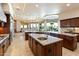 Spacious kitchen boasts dual islands, custom cabinets, and a seamless transition to the living space at 13141 E Cibola Rd, Scottsdale, AZ 85259