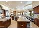Spacious kitchen featuring granite countertops, stainless steel appliances, and an open layout to living area at 13141 E Cibola Rd, Scottsdale, AZ 85259