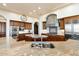 Gourmet kitchen showcasing granite countertops, stainless steel appliances, and a large island with a sink at 13141 E Cibola Rd, Scottsdale, AZ 85259