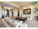 Elegant living room with neutral tones, ample seating, and custom decor at 13141 E Cibola Rd, Scottsdale, AZ 85259