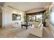 Bright living room with large windows offering scenic views, comfortable seating, and stylish decor at 13141 E Cibola Rd, Scottsdale, AZ 85259