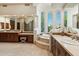 Elegant main bathroom featuring split vanities and luxurious soaking tub at 13141 E Cibola Rd, Scottsdale, AZ 85259