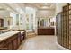 Open main bathroom design featuring tile floors, split vanities, and access to soaking tub at 13141 E Cibola Rd, Scottsdale, AZ 85259