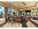 This elegant outdoor kitchen is the perfect spot to entertain with ample bar seating at 13141 E Cibola Rd, Scottsdale, AZ 85259