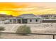 One-story home exterior showcasing desert landscaping and sunset views at 28204 N Royce Rd, Queen Creek, AZ 85144