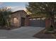 Brick home with a two car garage and desert landscaping at 28368 N 129Th Dr, Peoria, AZ 85383