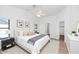 A bright and airy bedroom featuring a large window and ceiling fan for increased comfort at 3244 E Hononegh Dr, Phoenix, AZ 85050