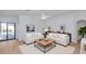 Bright living room showcasing modern neutral decor, stylish furnishings, and an open floor plan at 3244 E Hononegh Dr, Phoenix, AZ 85050