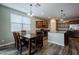 Eat-in kitchen with island and hardwood floors at 40076 W Ganly Way, Maricopa, AZ 85138