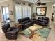 Relaxing living room with leather furniture and fireplace at 4680 E Blue Spruce Ln, Gilbert, AZ 85298