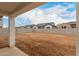 Spacious backyard under covered patio showcases surrounding properties and block wall at 4924 W Beryl Ave, Glendale, AZ 85302