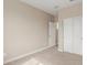 Neutral bedroom features carpet flooring, ensuite bathroom, and a closet with sliding doors at 4924 W Beryl Ave, Glendale, AZ 85302