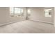 A large bedroom offers plenty of natural light from multiple windows showcasing neighborhood views at 4924 W Beryl Ave, Glendale, AZ 85302