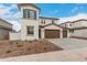 Charming two-story home featuring a terracotta roof, stucco siding, blue shutters, and a spacious three-car garage at 4924 W Beryl Ave, Glendale, AZ 85302
