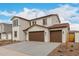 Charming two-story home featuring a terracotta roof, stucco siding, blue shutters, and a spacious three-car garage at 4924 W Beryl Ave, Glendale, AZ 85302