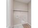 Functional laundry area features tile floors and a shelf at 4924 W Beryl Ave, Glendale, AZ 85302