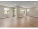 Open living area featuring tile flooring, recessed lighting, multiple windows, and glass sliding doors to the outdoors at 4924 W Beryl Ave, Glendale, AZ 85302
