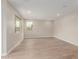 Bright living room with wood-look floors and recessed lighting, featuring ample windows with views of the neighborhood at 4924 W Beryl Ave, Glendale, AZ 85302