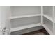 Walk-in pantry features ample shelving for organized storage of food and kitchen essentials in this home at 4924 W Beryl Ave, Glendale, AZ 85302
