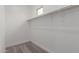 Bright walk-in closet with white walls, carpeted floor, and a window for natural light at 4924 W Beryl Ave, Glendale, AZ 85302