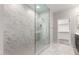 Bathroom featuring a glass shower with marble tile at 4925 W Beryl Ave, Glendale, AZ 85302
