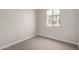 Cozy bedroom with natural light and carpet floors overlooking front yard at 4925 W Beryl Ave, Glendale, AZ 85302