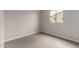 Well-lit bedroom with carpet and double-paned window at 4925 W Beryl Ave, Glendale, AZ 85302
