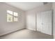 Bedroom featuring natural light, carpet, closet and double-paned window at 4925 W Beryl Ave, Glendale, AZ 85302