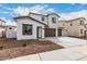 Beautiful new construction house with a spacious driveway and minimalist landscaping at 4925 W Beryl Ave, Glendale, AZ 85302