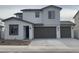 Charming two-story home features a three-car garage and neutral paint scheme at 4925 W Beryl Ave, Glendale, AZ 85302