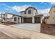 Wide angle view of a modern two-story home with neutral colors and a spacious driveway at 4925 W Beryl Ave, Glendale, AZ 85302
