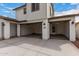 Spacious two-car garage with high ceilings and modern lighting fixtures at 4925 W Beryl Ave, Glendale, AZ 85302