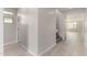 Bright hallway with wood-look floors, neutral walls, and access to the upper floor at 4925 W Beryl Ave, Glendale, AZ 85302