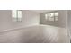 Bright, open-concept living room featuring tile floors and large windows at 4925 W Beryl Ave, Glendale, AZ 85302